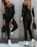 Two piece gigot sleeve top and trousers set in black, front view