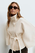 Cape coat with high collar and belted waist in beige, front view