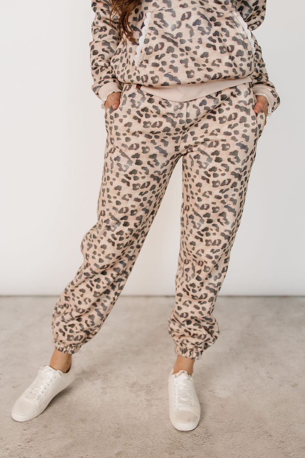 Fleece lined leopard print joggers with lace pocket, front view