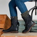 Mid calf boots with rhinestone detail in black, side view