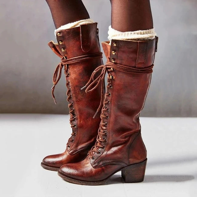 Lace-up knee boots in black leather-look finish, shown as sleek tall boots