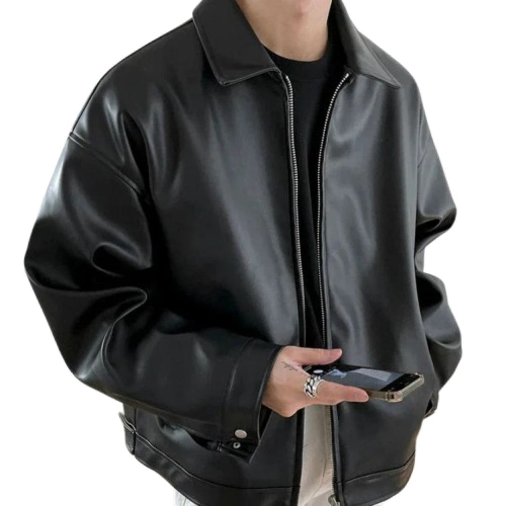 Oversized leather-look bomber jacket in black, shown in a relaxed streetwear fit