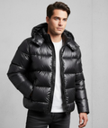 Quilted hooded puffer jacket in black, front view