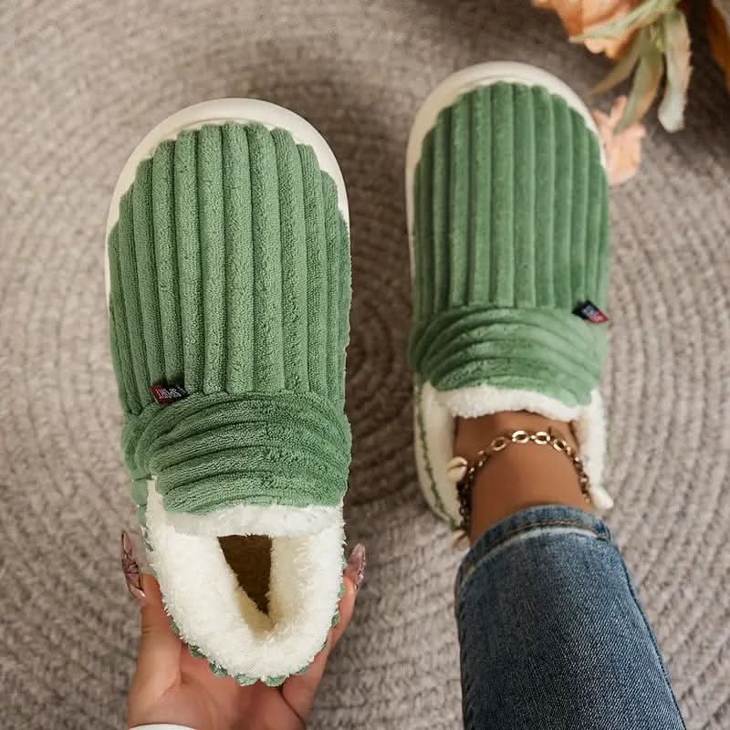 Thermal fleece-lined house slippers with a non-slip sole, shown in a cosy winter style