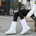 Waterproof mid-calf boots in black, side view