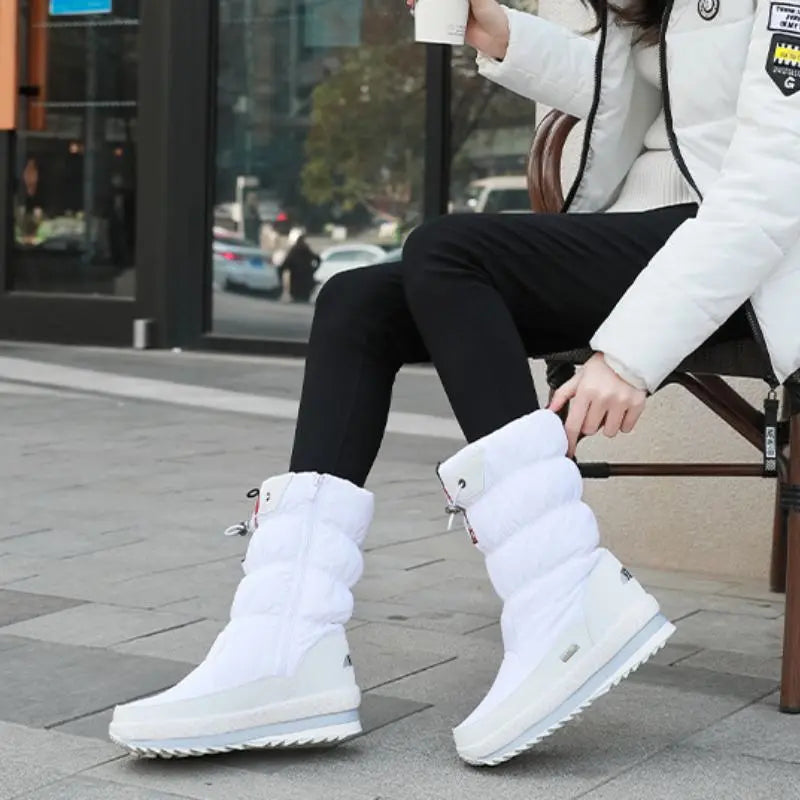 Waterproof mid-calf boots in black, side view