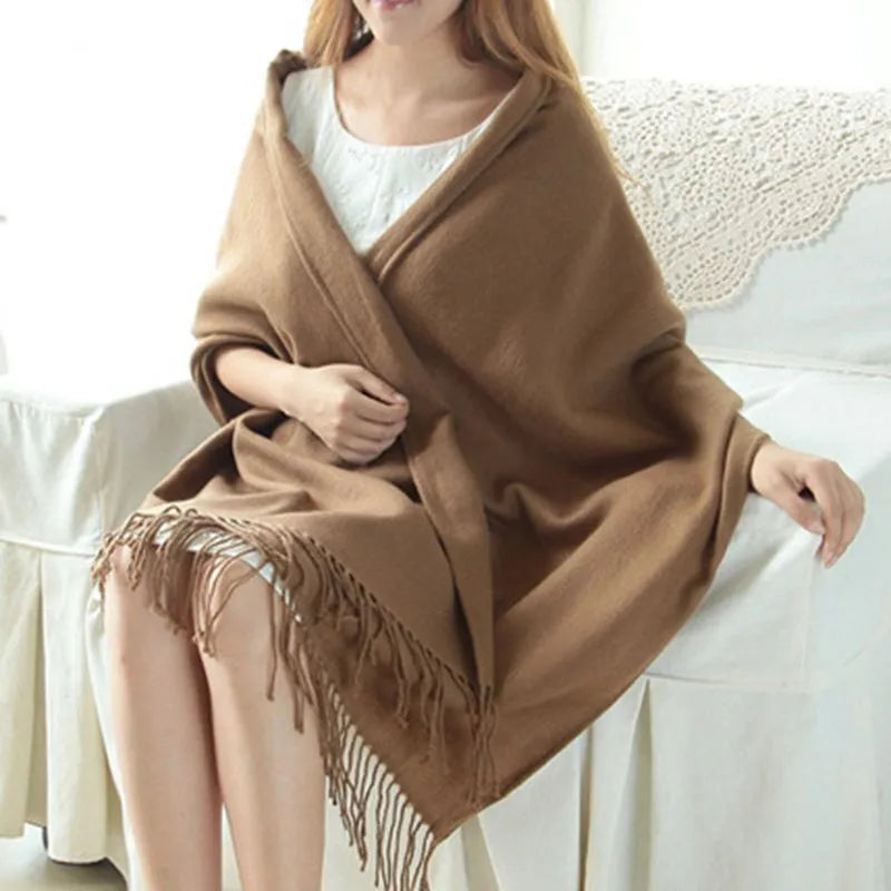 Oversized soft-knit winter scarf in brown, draped