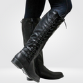 Knee high leather-look boots with block heel in black, side view