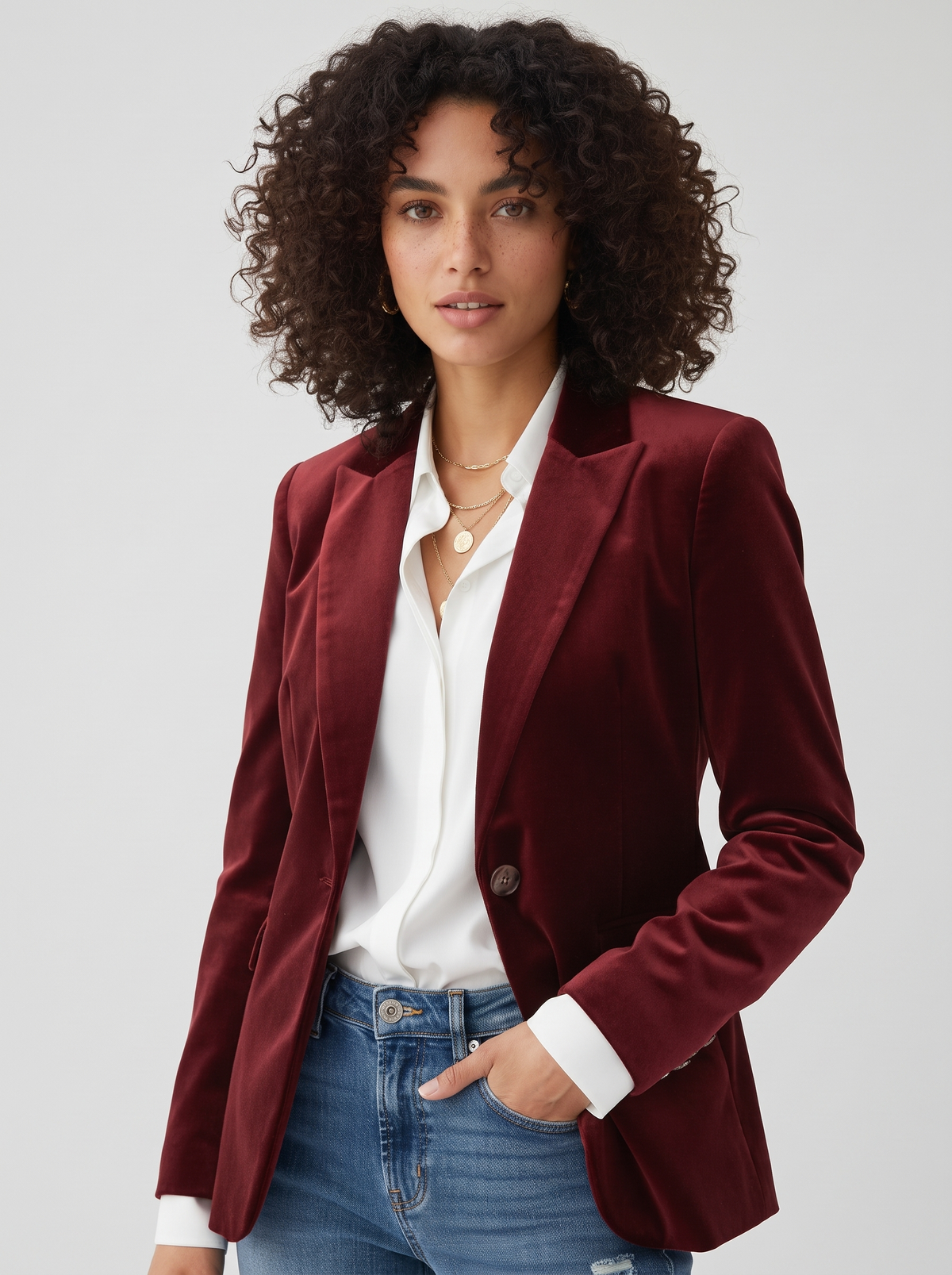 Velvet Blazer Gold Button Detail on light grey studio background