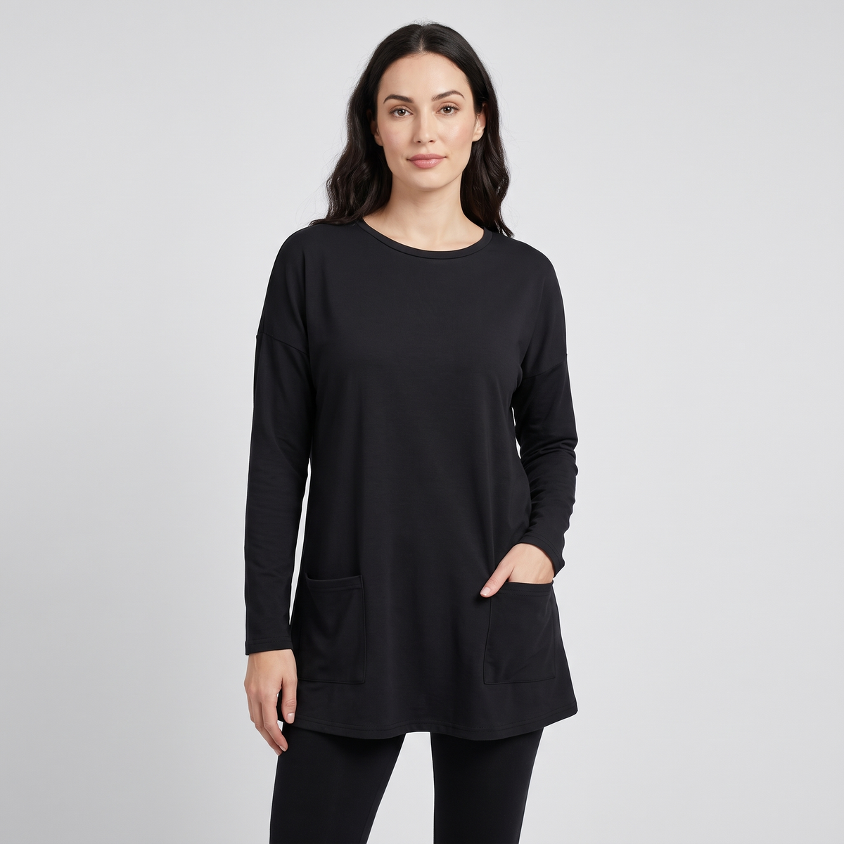 Oversized tunic sweater with pockets in black, front view