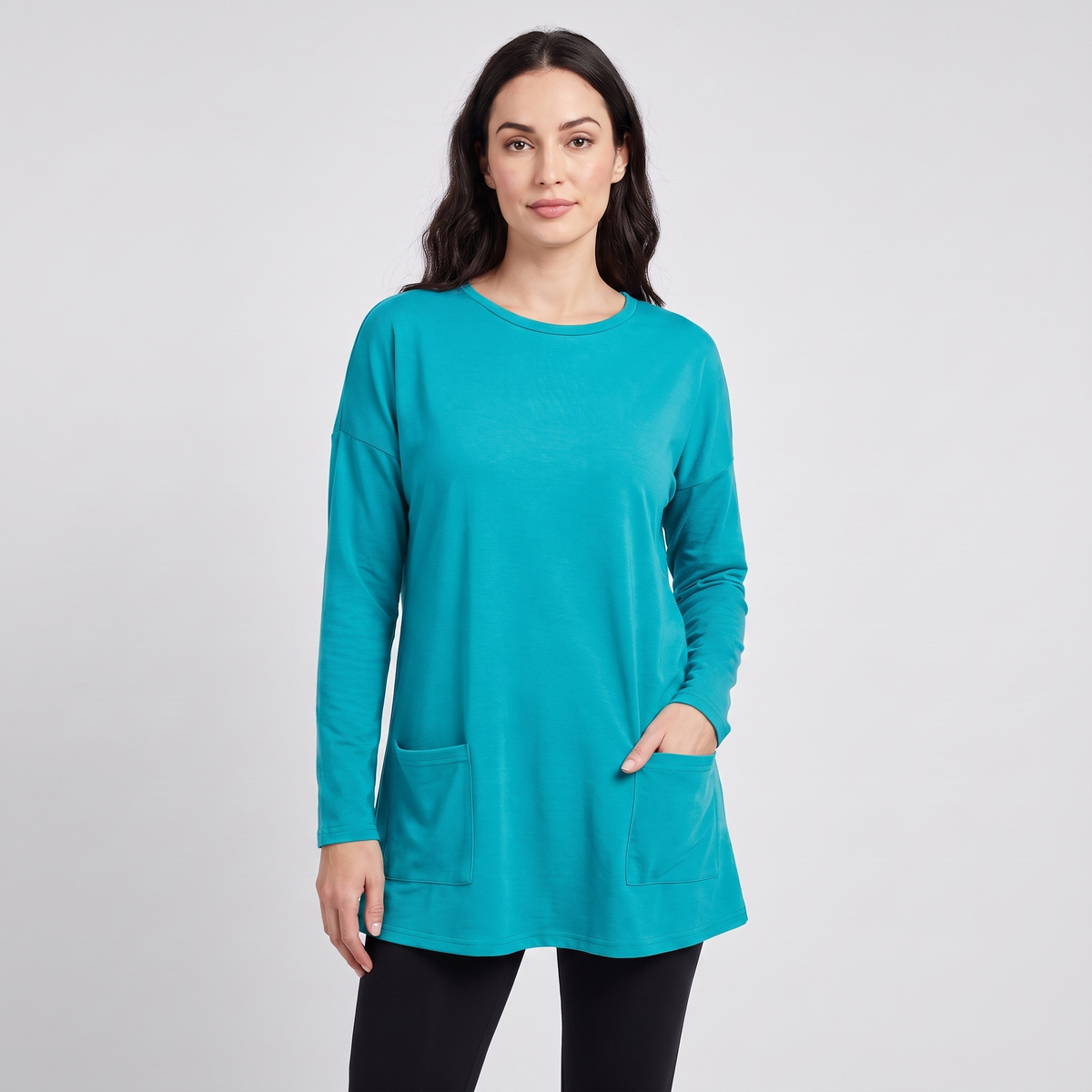 Oversized tunic sweater with pockets in turquoise, front view