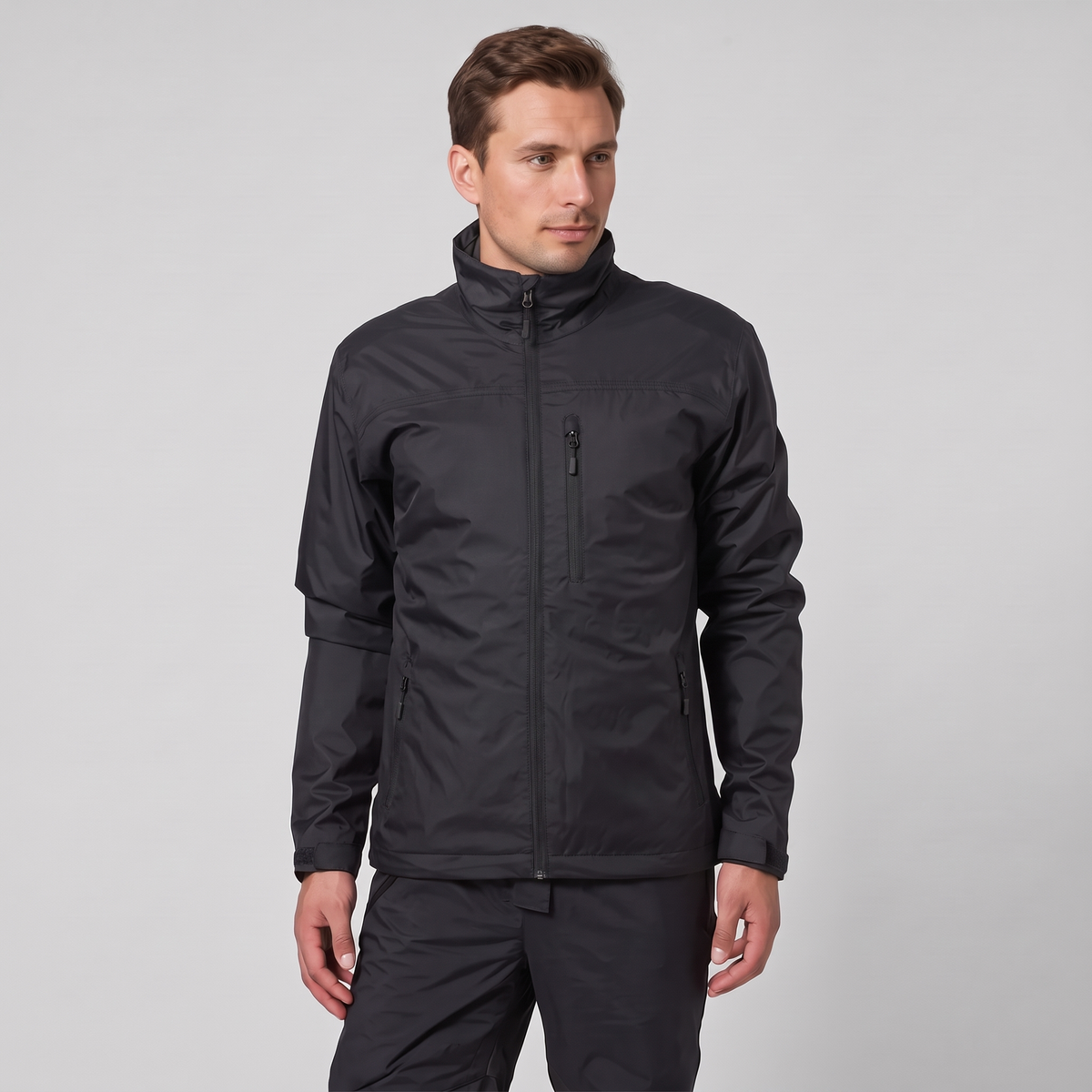 Waterproof breathable windbreaker jacket in black, worn by model