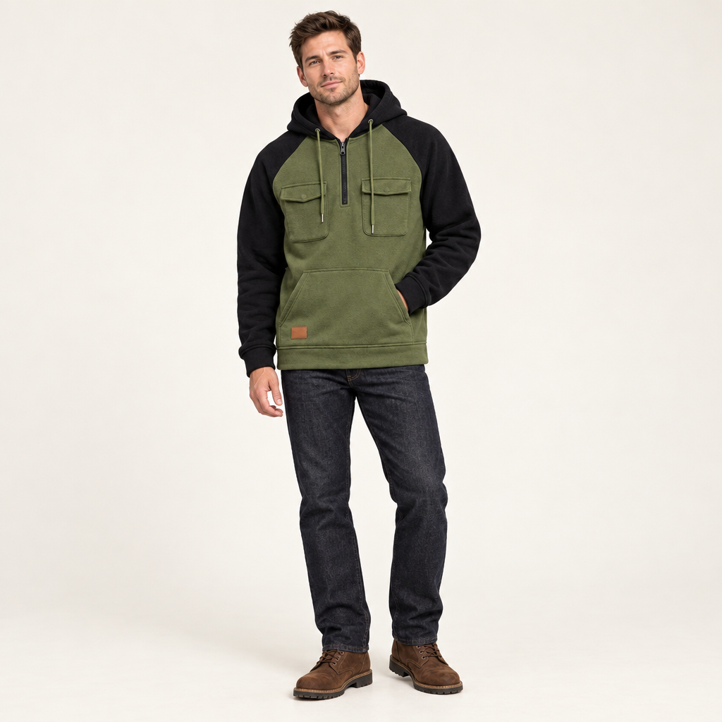 Colour block quarter zip hoodie in olive with black sleeves and hood, worn with jeans