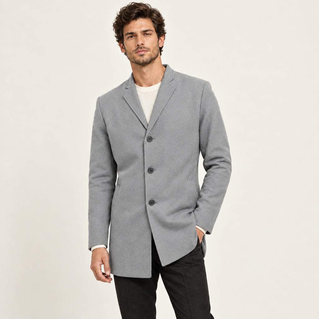 Grey collarless wool-blend jacket with a tailored slim fit, worn by a model