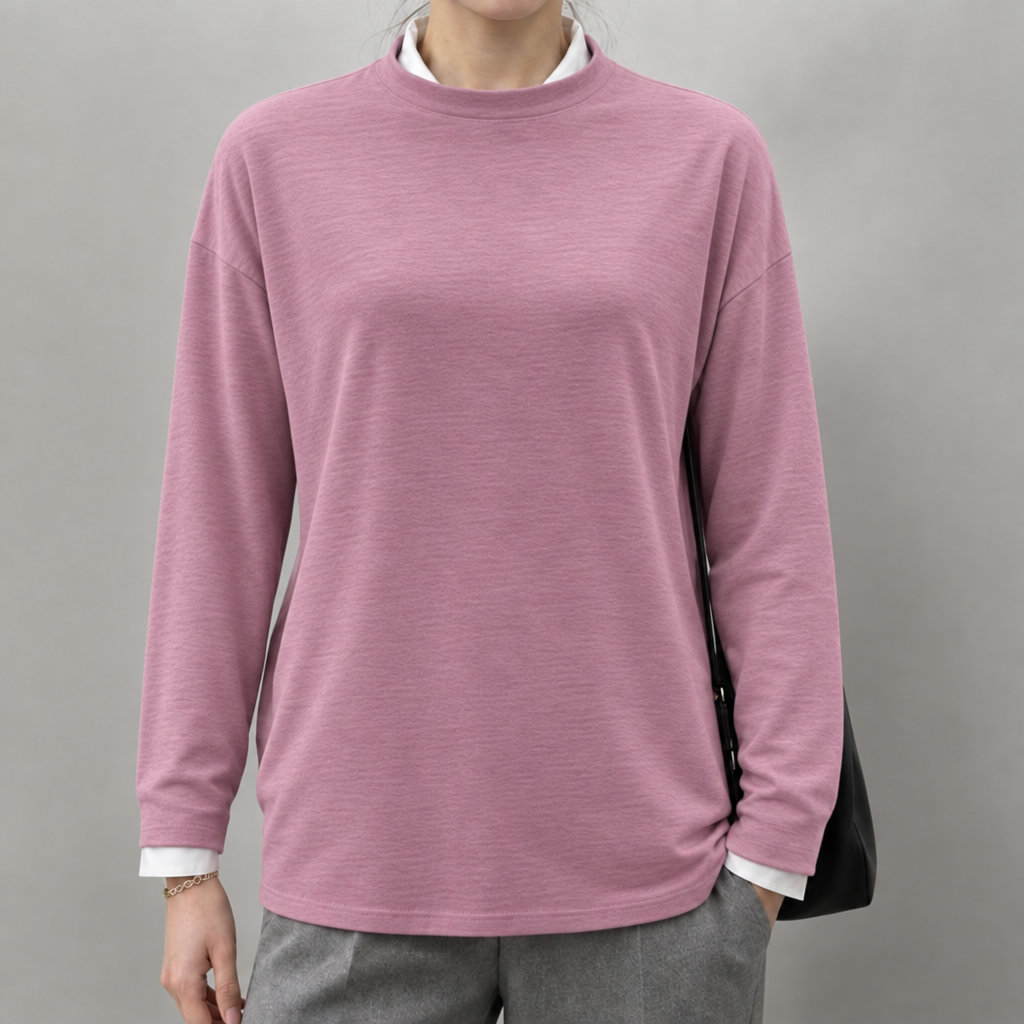 Grey lightweight round neck jumper layered over a white shirt, worn by a model