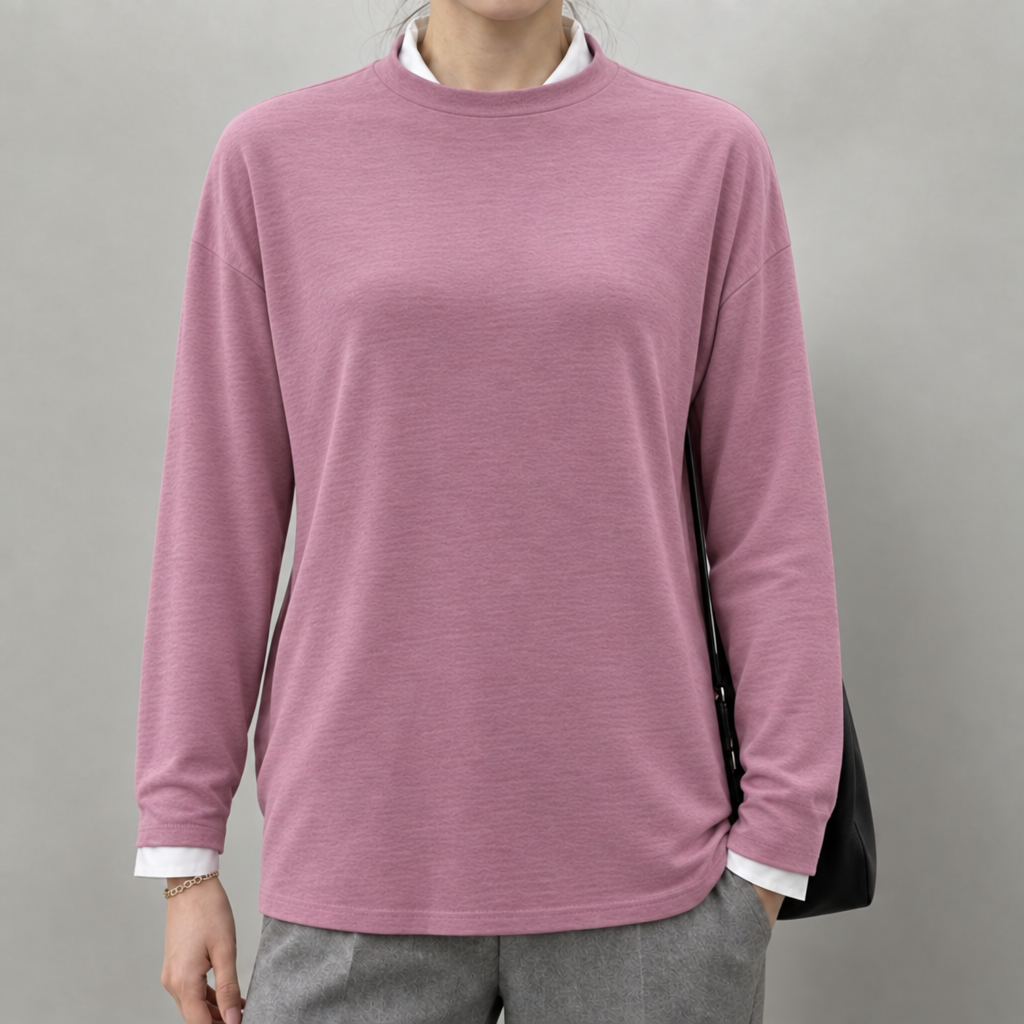 Black lightweight round neck jumper layered over a white shirt, worn by a model