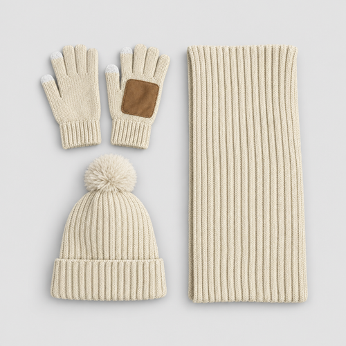 Knit winter set with hat, scarf and gloves in beige, studio photo