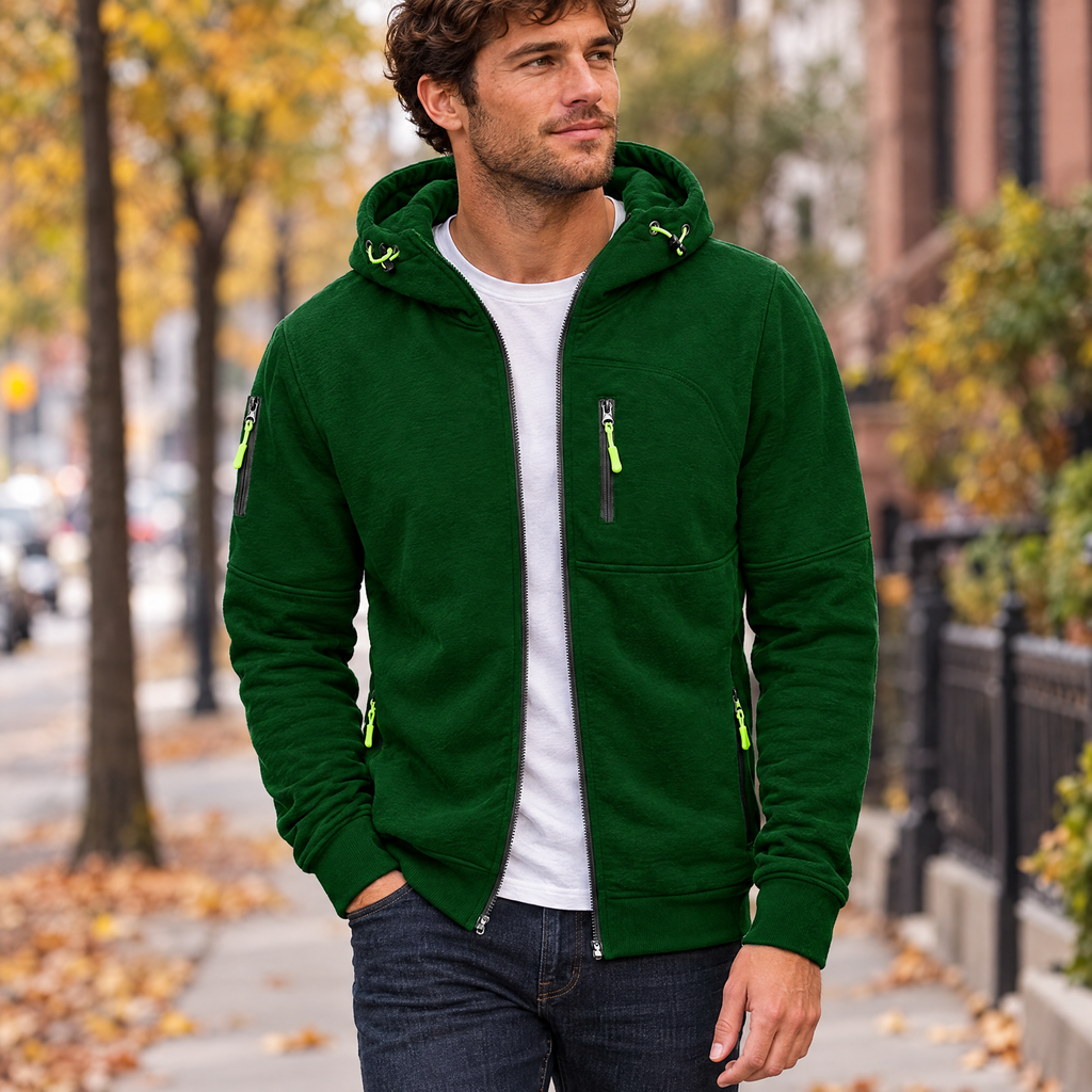 Full zip hoodie in green worn with jeans on a city street