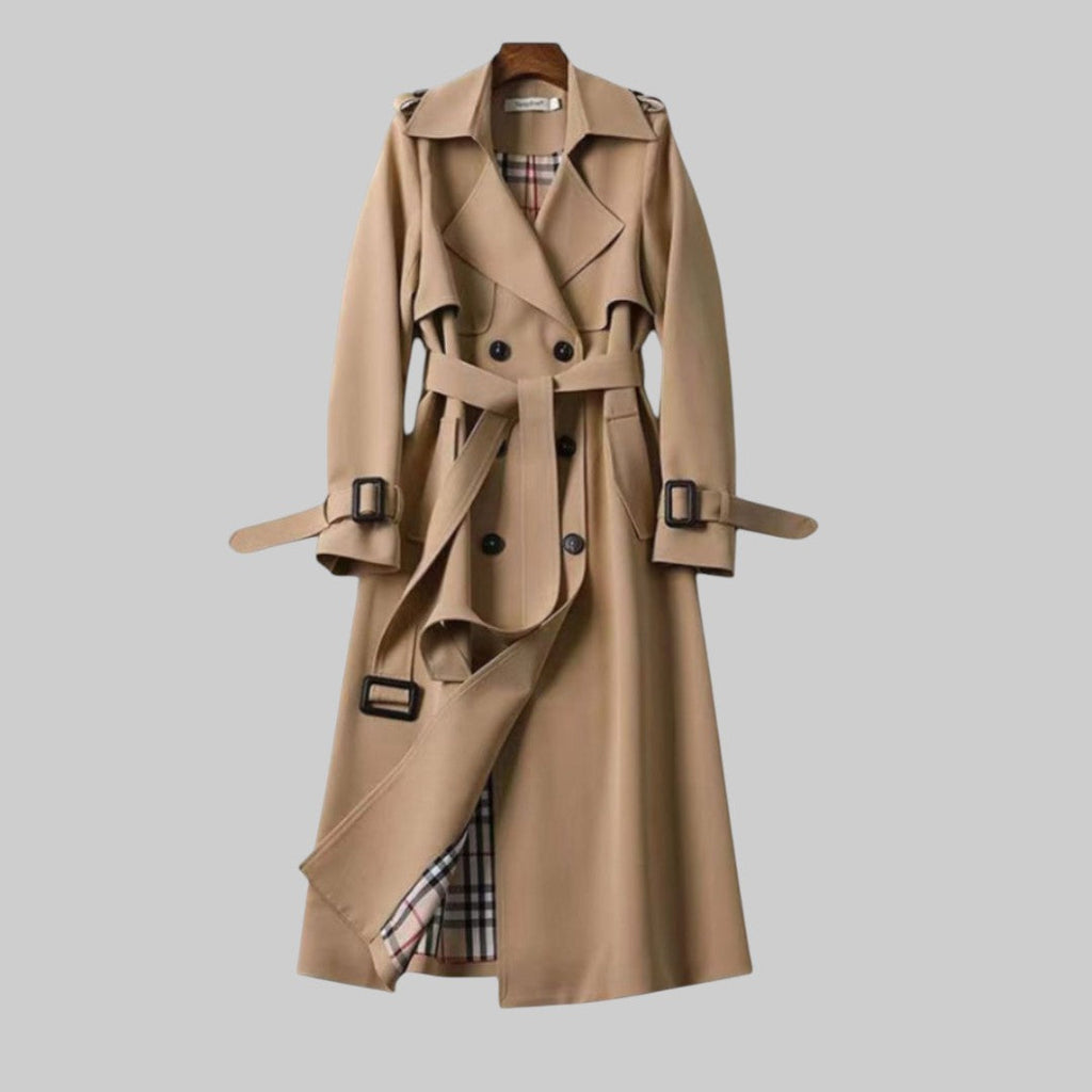 Belted double-breasted trench coat in beige, shown in a longline silhouette