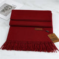 Long soft knit winter scarf in burgundy, flat lay