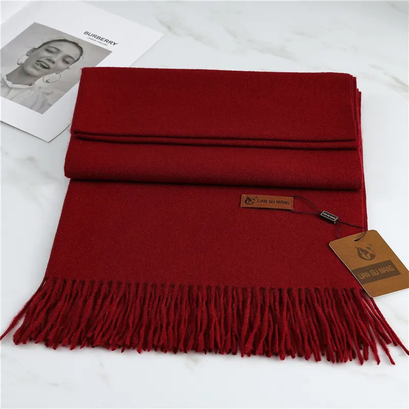 Long soft knit winter scarf in burgundy, flat lay