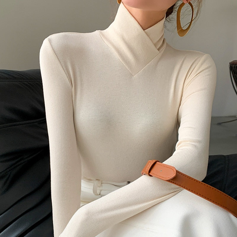 Fleece lined stretch turtleneck top in ivory, front view