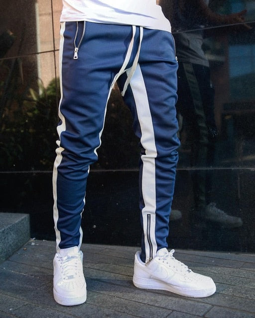 Joggers with contrast side stripes in grey, front view