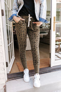 Skinny fit joggers in green leopard print, front view